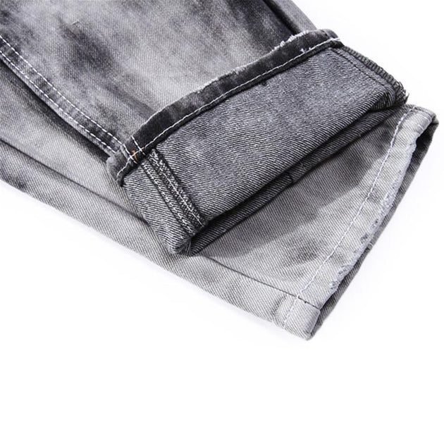 Men's Ripped Jeans With Sequined Skulls - TrendSettingFashions 